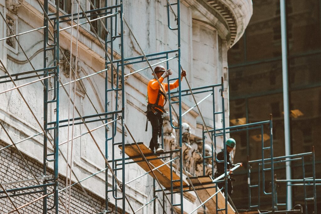 3 men climbing on ladder